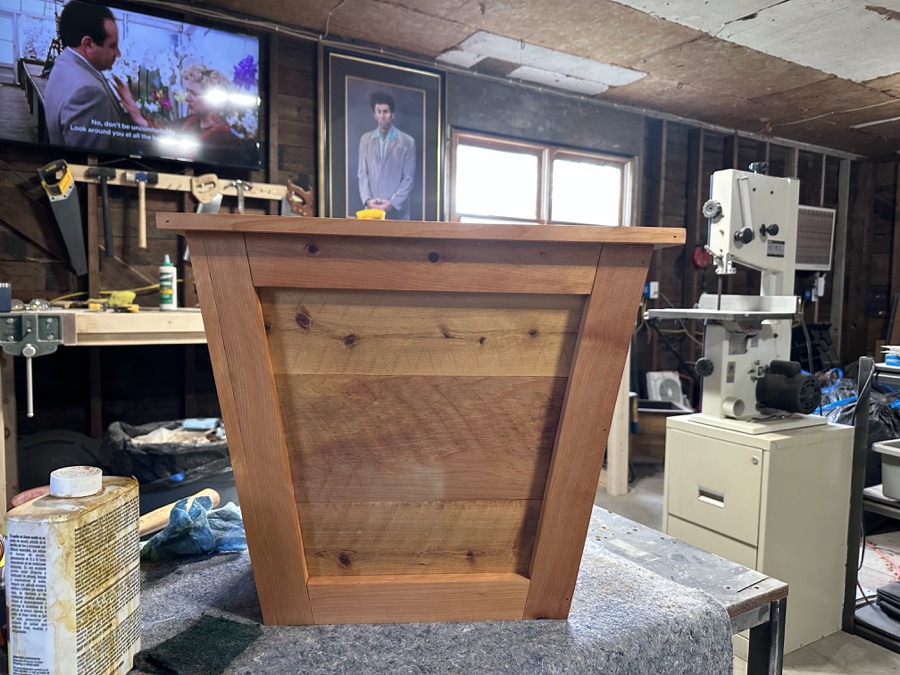 Front profile of completed cedar planter in workshop